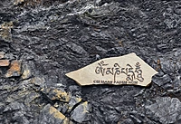 Laser engraved Tibetan Mantra on rock